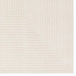 Close-up showing sharp corner with concentric geometric lines in cream high-low pile
