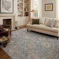 Louisa Ocean Sunset Rug styled in a living room with beige sofa and wooden flooring
