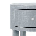Close-up of drawer front and silver drawer knob details with textured washed lacquered linen finish