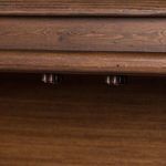 Interior underside of sideboard top with wooden hinges and aged finish