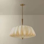 Flinders pendant illuminated, casting soft warm light in a neutral room setting