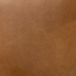 Close-up of butterscotch leather texture on stool seat and backrest