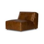 Armless vintage-style accent chair in soft camel top-grain leather with low profile and stitched seat and back