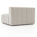 Side close-up of vertical channel alignments from armrest to seat cushion in light neutral upholstery