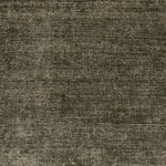 Close-up of Blanton Outdoor Rug's broken loops in the textured heathered olive surface