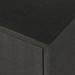 Close-up of smooth woven raffia surface covering cabinet edges