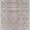 Traditional machine woven rug with intricate black and blue floral motifs on a soft beige background featuring fringe edges