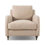 Lynne Chair with rolled arms, sink-in cushions, turned wood legs with casters, upholstered in soft beige linen-cotton blend