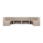Front angled view of U-shaped banquette highlighting vintage white rattan texture and cushioned seating