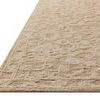 Side close-up showing the rug’s low-loop background and higher-loop floral pattern with textured depth