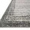 Close-up angled view showing the rug's low pile texture and cleanly finished edges