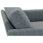 Close-up of back cushion angled on chair arm, revealing upholstery pattern alignment