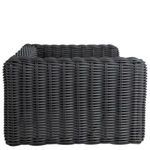 Side profile of woven lounge chair showing depth and cushion placement