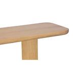 Close-up on the curved half-bullnose edge and smooth oak texture of the bench top