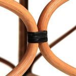 Close-up of curved rattan supports joined with smooth black bindings