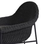 Close-up of armrest showing detailed woven texture and supporting thin metal frame