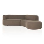 Sectional shown from the right side, highlighting the rounded shape of the chaise end.