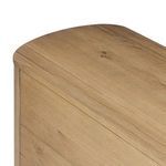 Close-up showing smooth top surface and softened rounded edges in oak finish