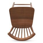Top-down look at walnut stool seat revealing smooth grain and curved backrest