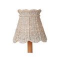 Front view of the whitewashed seagrass tapered shade on a wood base with scalloped bottom edge