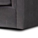 Close-up on leather texture and stitching on side panel of chair