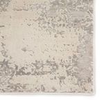 Detailed close-up of gray accents and textured abstract pattern near rug edge
