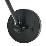 Close-up of round black wall mount with pivot joint and screw details