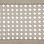 Close-up of woven ivory rope pattern on chair backrest