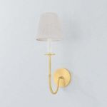 Amina Wall Sconce viewed slightly from the left, showing linen shade texture and brass finish