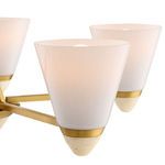 Close-up on Kohlman chandelier’s white opal glass shade with brass ring and travertine tip