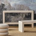 Console table with side and front profile next to matching bench and round pouf
