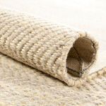 Rolled edge close-up emphasizing thick woven fibers and natural texture