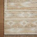 Close-up of Rivers Natural Ivory Rug corner showing detailed woven texture and fringed edge on hardwood floor
