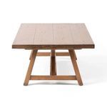 End view showing the angled legs and thickness of the rectangular pine tabletop with natural wood texture