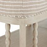 Close-up of beige fabric upholstery with white textured horizontal stripes and wood frame corner