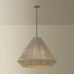 Keats pendant hanging in a room setting with soft muted walls, shown at a distance including ceiling mount and chain