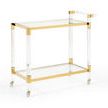 Boulevardier Bar Cart with clear acrylic frame, gold stainless steel accents, two clear glass shelves, and four caster wheels