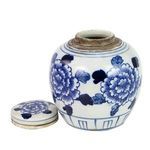 Jar with lid removed showing open top neck and floral design on lid placed beside it