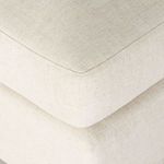 Detailed close-up of seat cushion corner with piped edge stitching