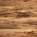 Natural wood grain detail with dark streaks and light brown tones on table surface