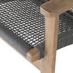 Close-up of eucalyptus armrest and seat corner with wrapped gray cord