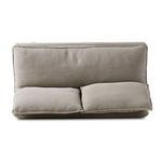 Loose back cushions and seat cushion edges visible in a close-up from above and side