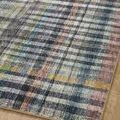 Angled close-up of Humphrey Plum rug showing subtle color variations in blue, plum, cream, and green