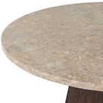 Angled close-up of onyx tabletop edge with visible stone patterns and rounded finish