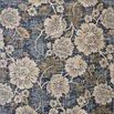 Botanical denim blue and natural area rug with large floral pattern in soft, muted tones