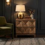 Musashi Walnut 2 Drawer console table styled in dark room with lamp, books, and vase on top