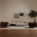Same living room as prior, left side of sofa reclined with footrest extended
