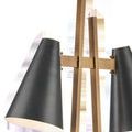 Close-up of matte black conical shades and antique brass metal bars showing screw details