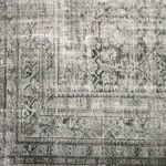 Detailed view of faded floral border design with linear accents