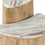 Angled close-up of marble top with subtle taupe and brown veining on nesting tables